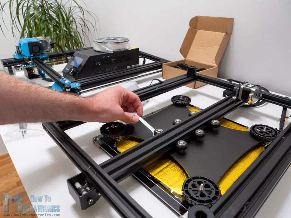 Adjusting the 3D printer bearing wheels using the eccentric nuts