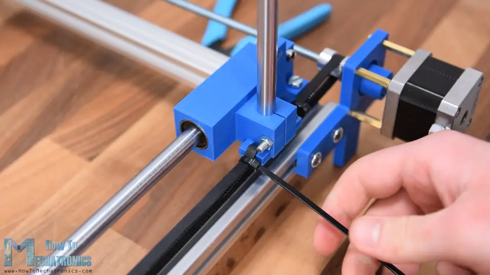 Attaching GT2 belt on the sliding block on the X-axis of the CNC machine